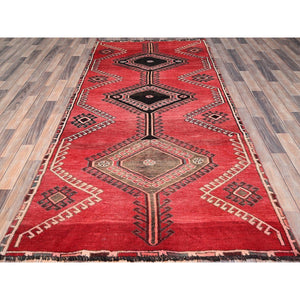 4'3"x9'3" Rusty Red, Semi Antique Shiraz with Geometric Medallion, Evenly Worn, Full Pile, Organic Wool, Sides And Ends Professionally Secured and Cleaned, Sheared Low, Hand Knotted, Distressed, Wide Runner Oriental Rug FWR520080